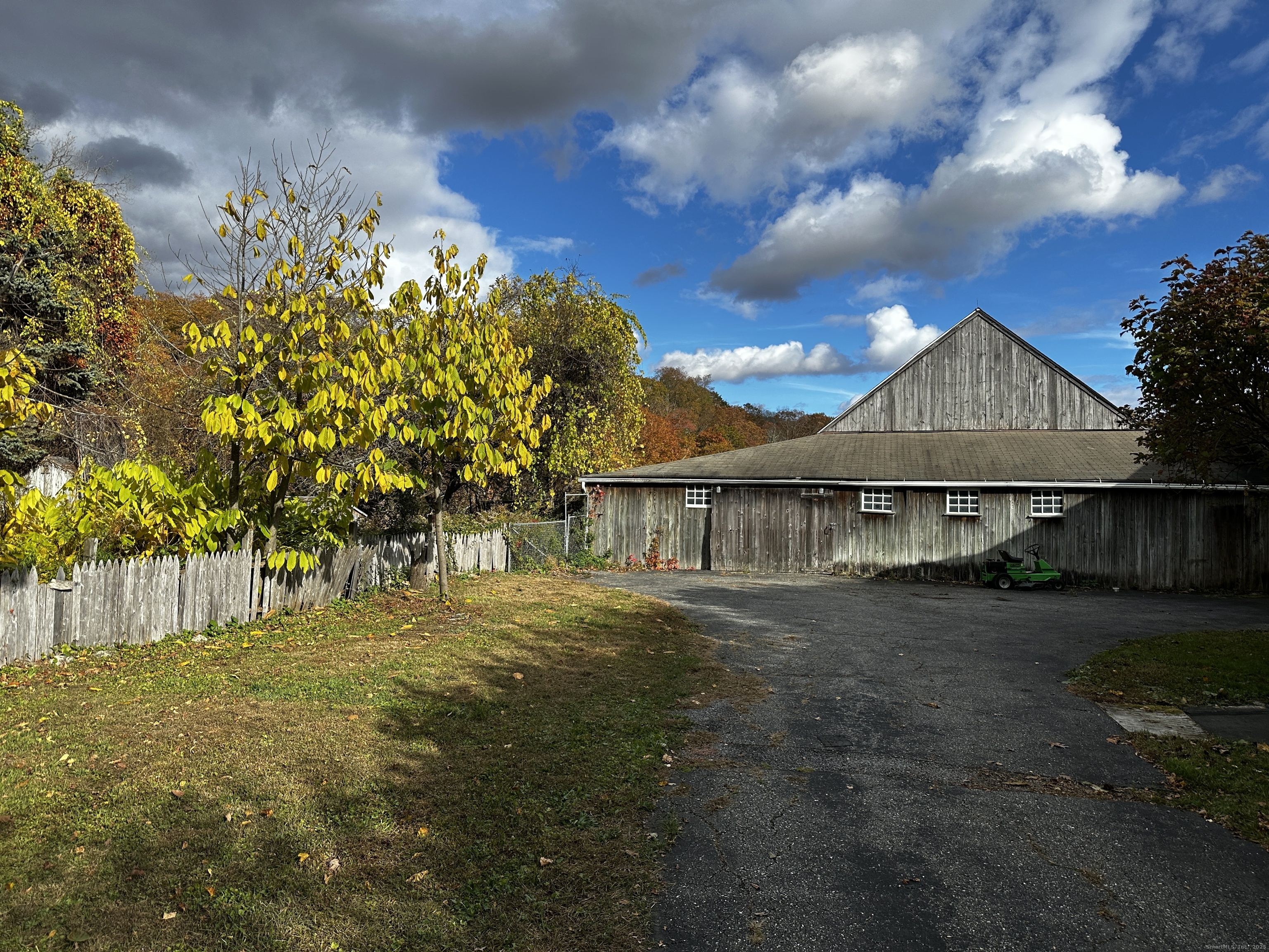 308 Skiff Mountain Road Kent, CT 06757 - Photo 16 of 18 a front view of a house with a garden