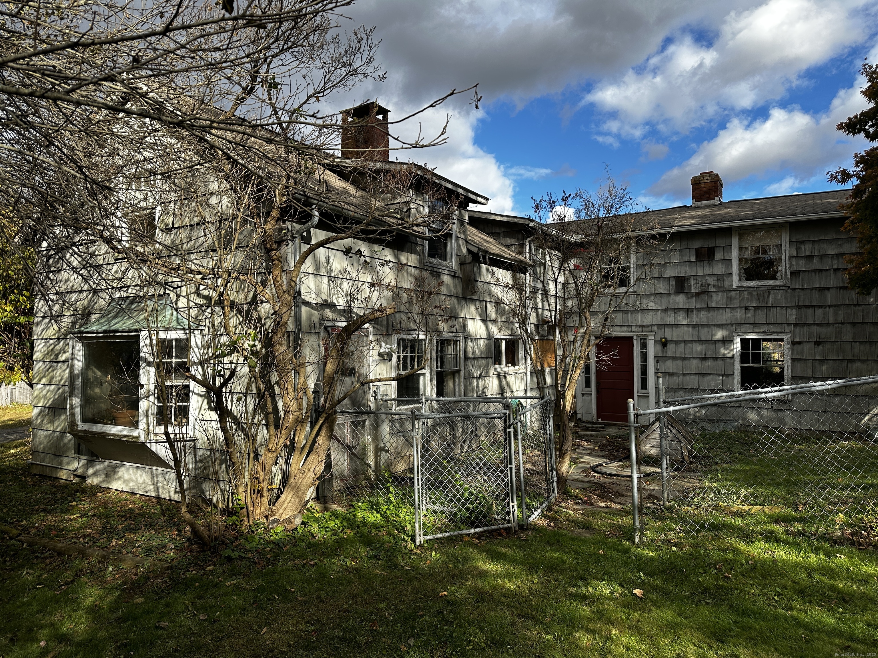 308 Skiff Mountain Road Kent, CT 06757 - Photo 18 of 18 a brick building with a yard in front of it