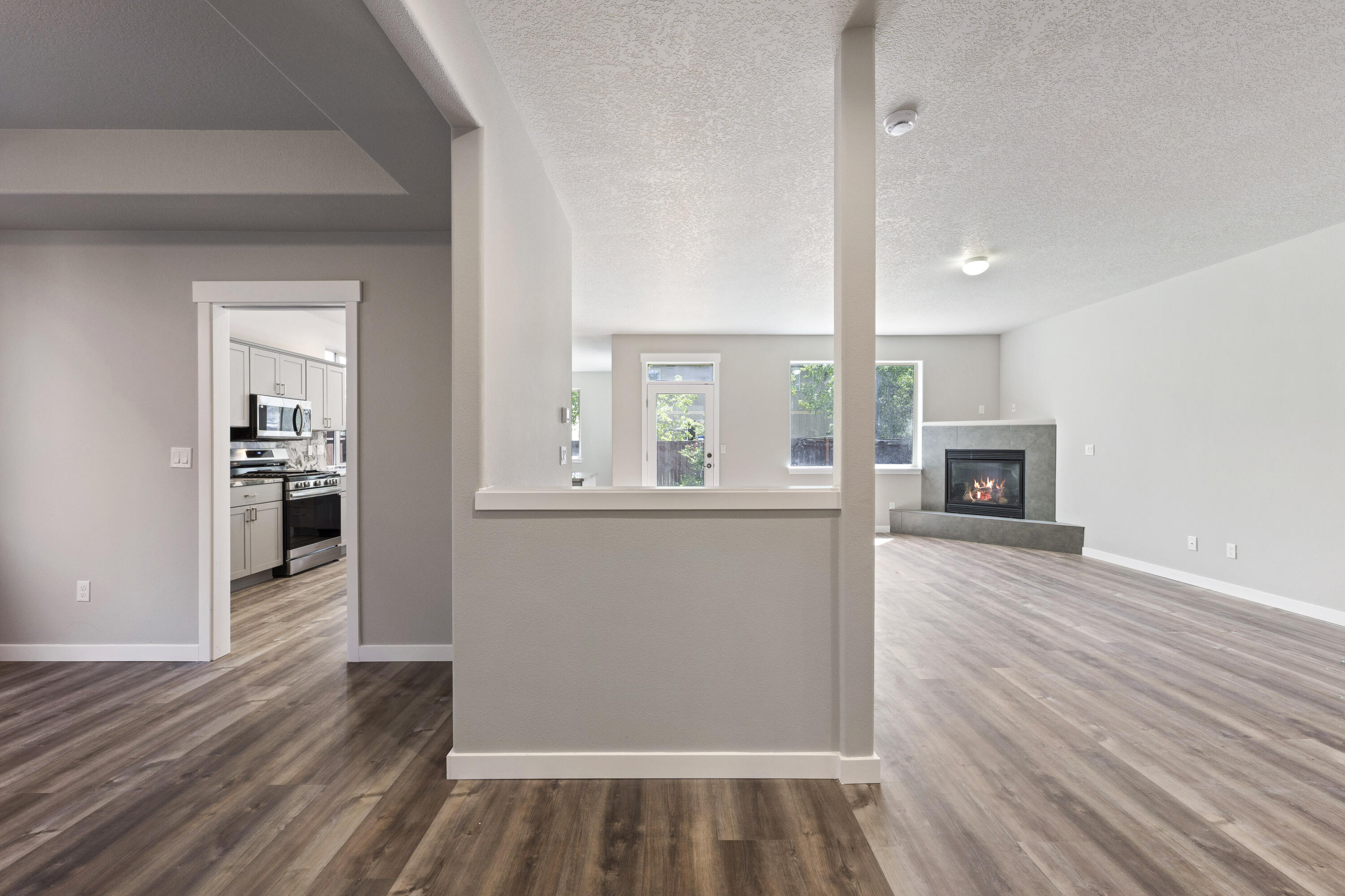 21189 Ritz Place Bend, OR 97702 - Photo 13 of 37 wooden floor in an empty room with a window