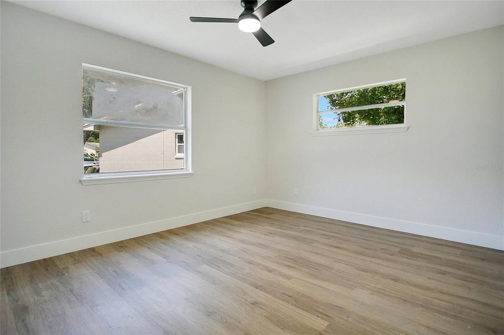 1914 Bonanza Court Winter Park, FL 32792 - Photo 14 of 33 a view of an empty room with wooden floor and a window