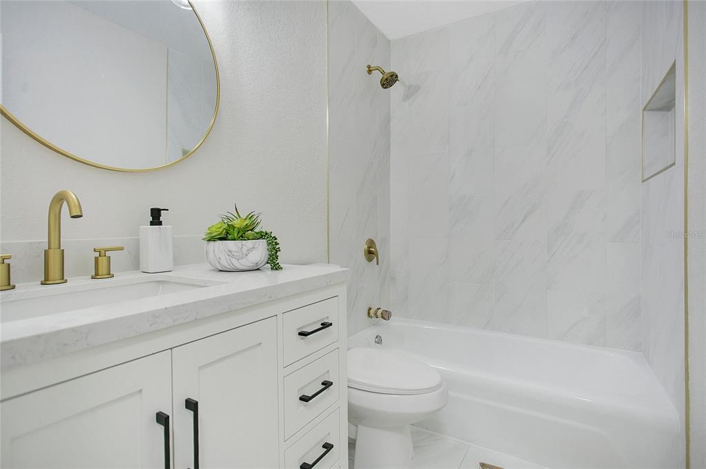 1914 Bonanza Court Winter Park, FL 32792 - Photo 15 of 33 a bathroom with a sink a toilet and bathtub