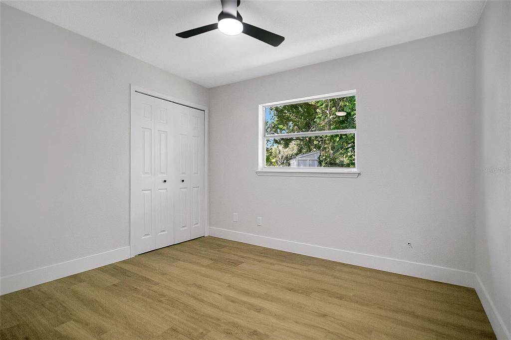1914 Bonanza Court Winter Park, FL 32792 - Photo 16 of 33 a view of an empty room with wooden floor and a window