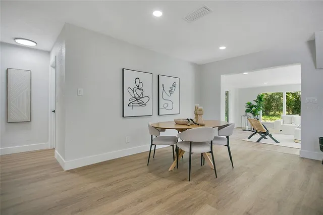 a workspace with furniture window and wooden floor