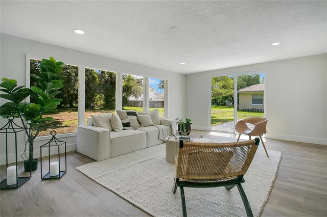a living room with furniture and a large window