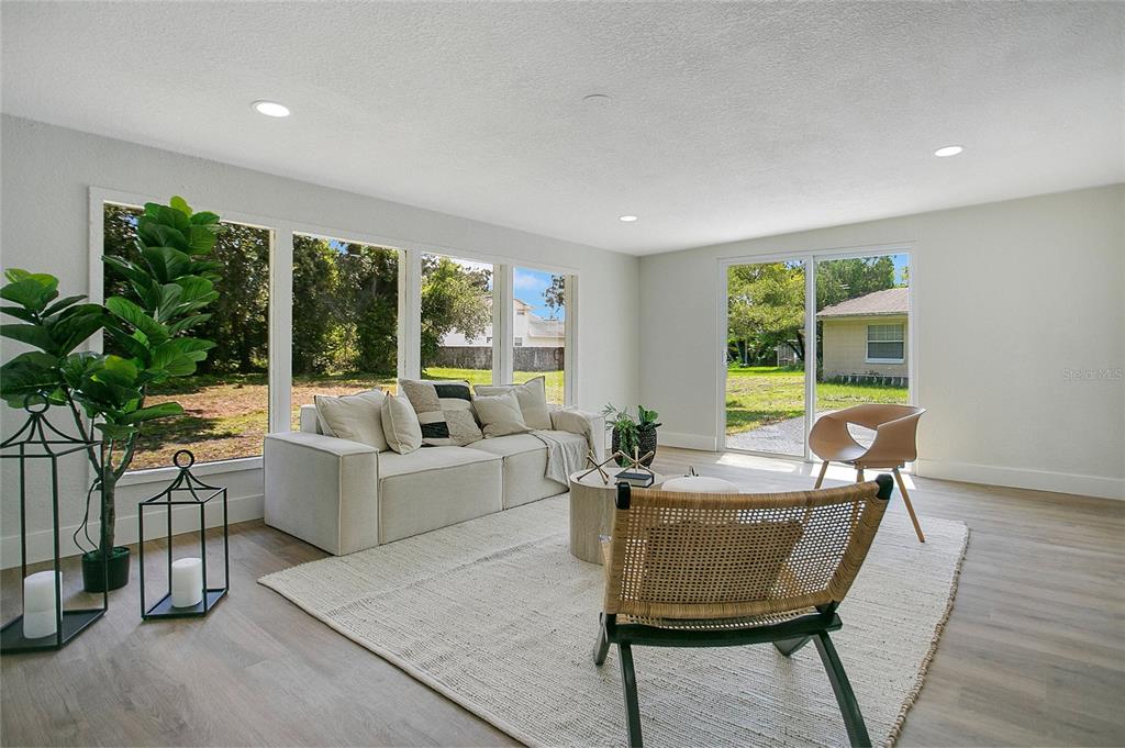 1914 Bonanza Court Winter Park, FL 32792 - Photo 18 of 33 a living room with furniture and a large window