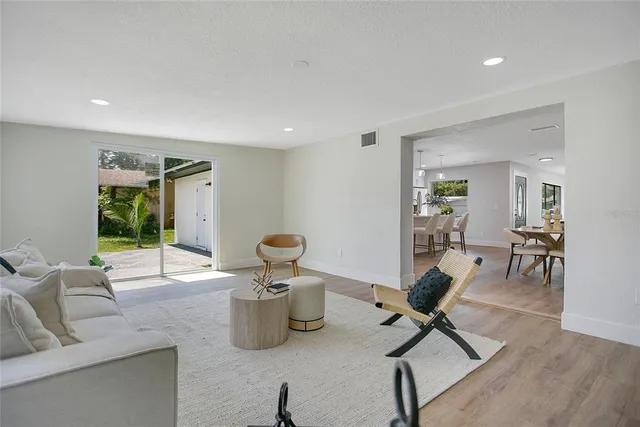 a view of a livingroom with workspace and a couch