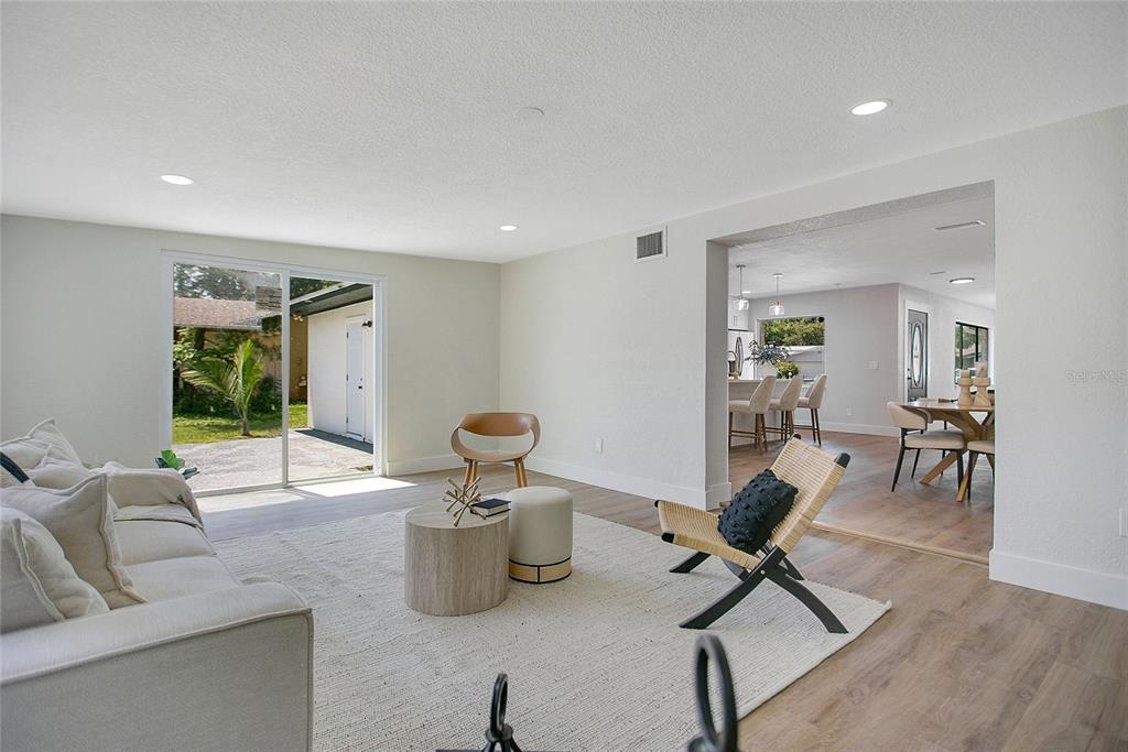 1914 Bonanza Court Winter Park, FL 32792 - Photo 19 of 33 a view of a livingroom with workspace and a couch