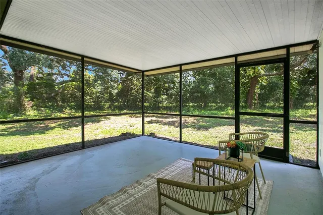 a view of a living room and a floor to ceiling window