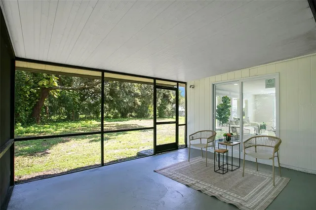 a living room with large windows