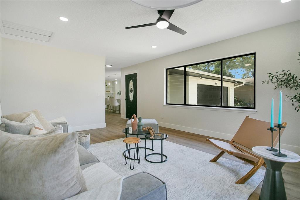 1914 Bonanza Court Winter Park, FL 32792 - Photo 4 of 33 a living room with furniture a window and gym equipment