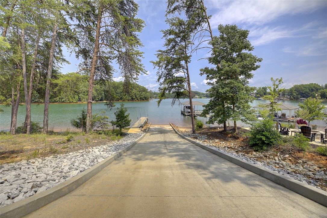 Lot 24 Reservoir Road West Union, SC 29696 - Photo 27 of 46 A private boat ramp leads directly to serene lake waters, perfect for aquatic adventures.