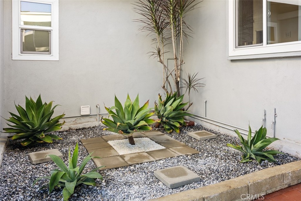219 South Meadow Road West Covina, CA 91791 - Photo 26 of 26 a potted plant sitting in front of a window