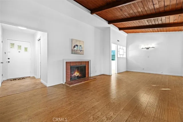 a view of an empty room with a fireplace