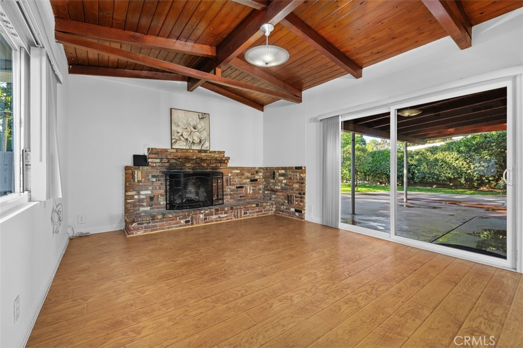 219 South Meadow Road West Covina, CA 91791 - Photo 9 of 26 a view of an empty room with windows and fireplace