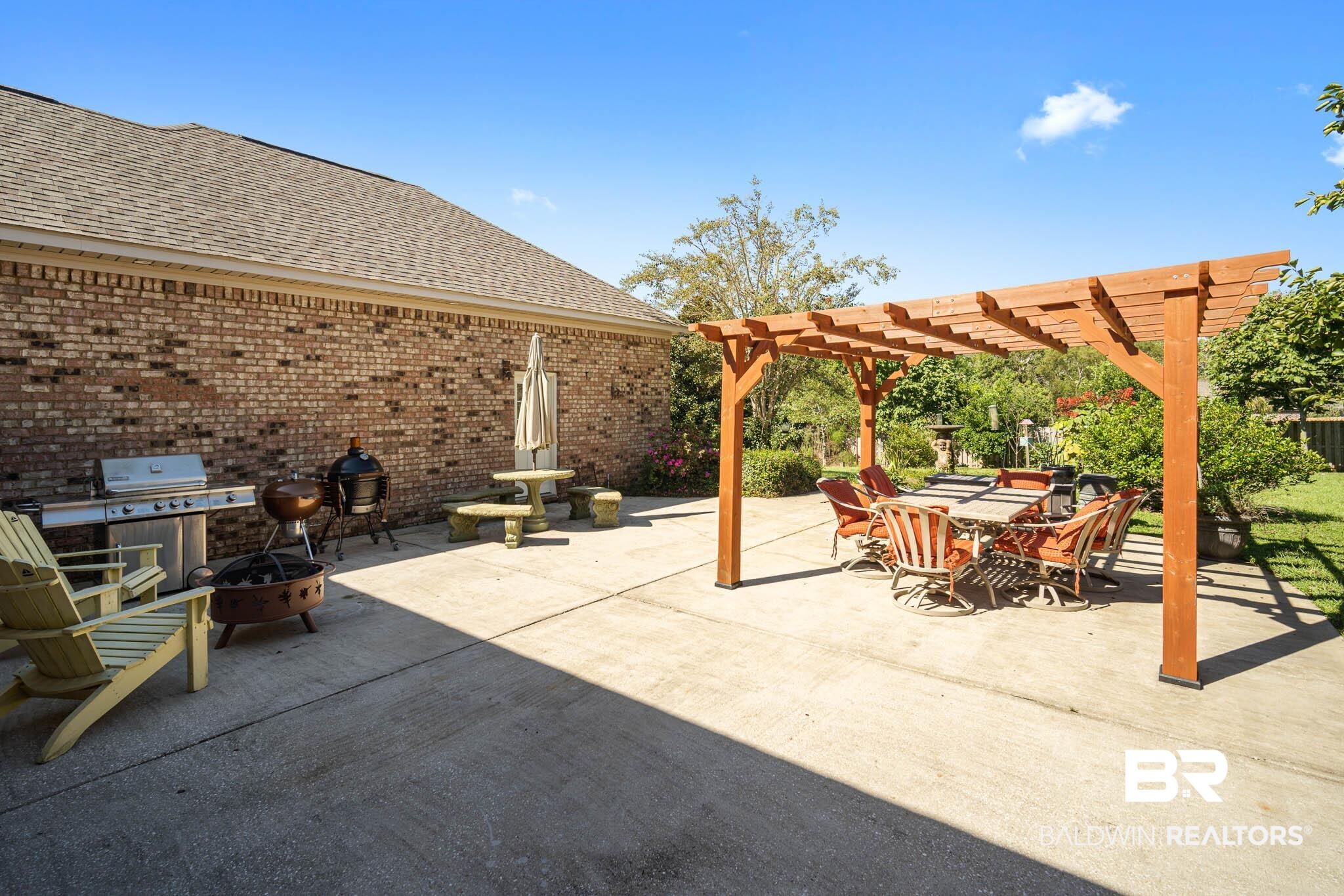 24121 Trowbridge Court Daphne, AL 36526 - Photo 33 of 46 Backyard with Pergola