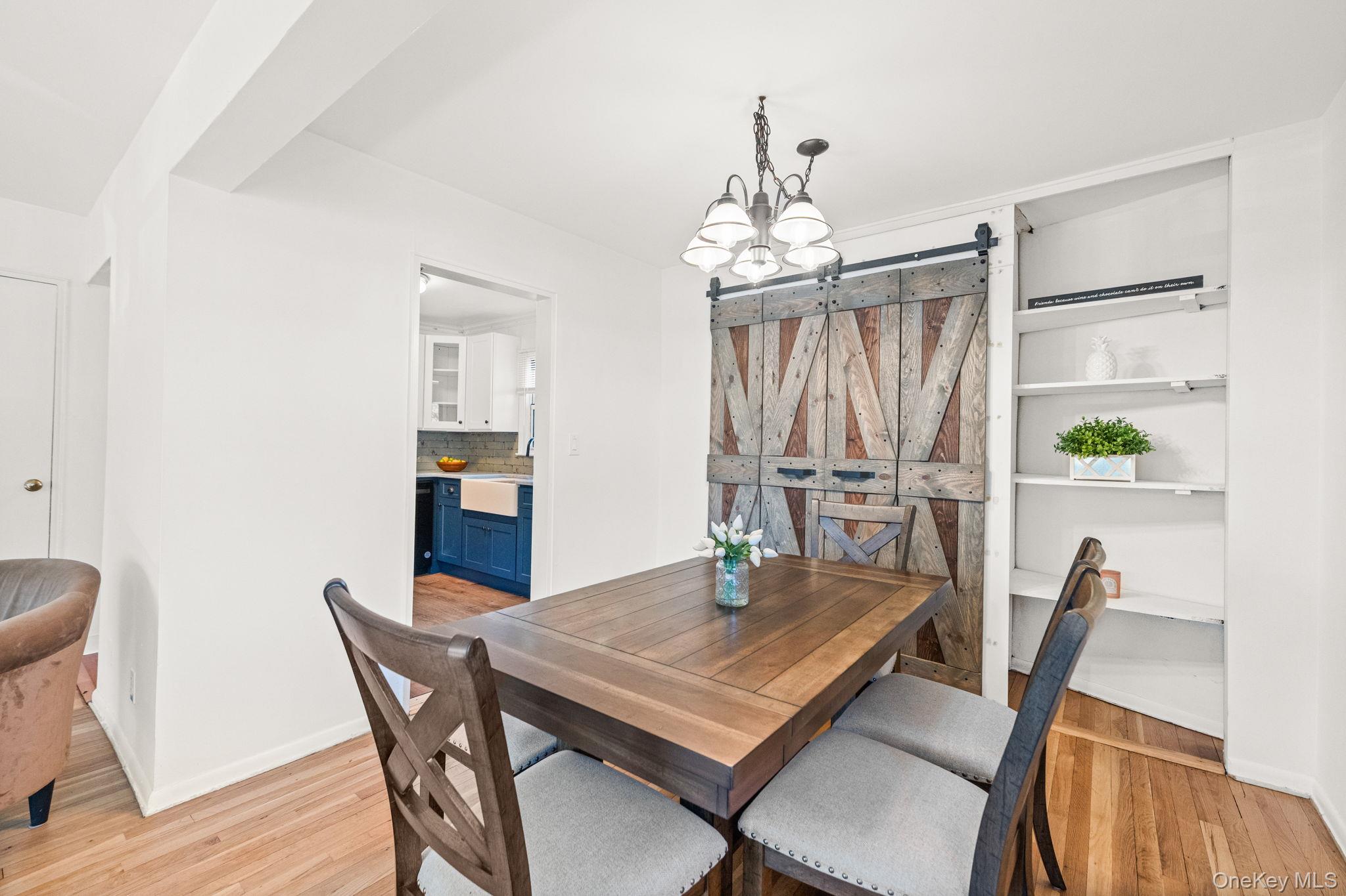 9 Geneva Road, Unit 9 Ossining, NY 10562 - Photo 11 of 26 a view of a dining room with furniture and a chandelier