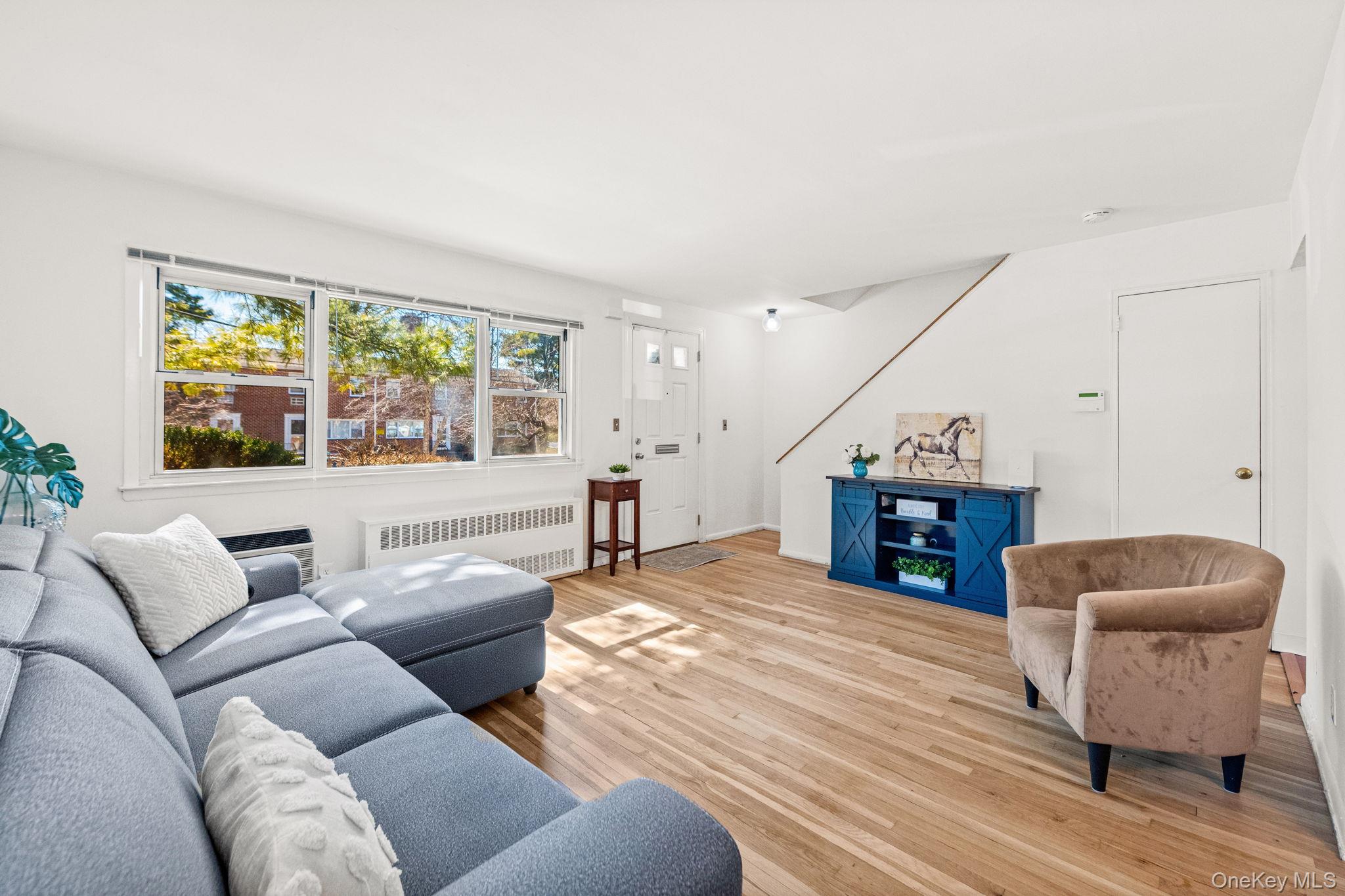 9 Geneva Road, Unit 9 Ossining, NY 10562 - Photo 12 of 26 a living room with furniture and a large window