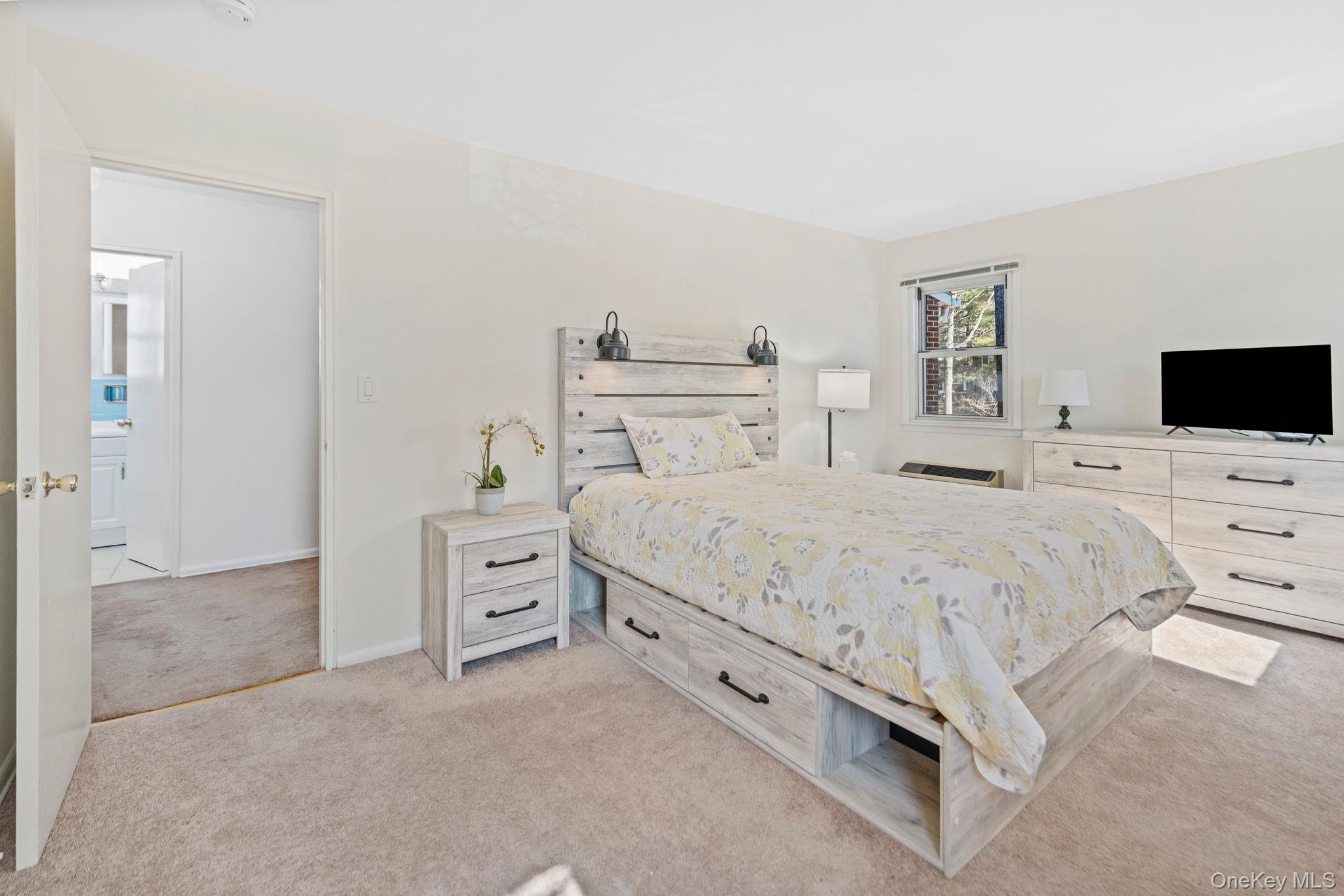 9 Geneva Road, Unit 9 Ossining, NY 10562 - Photo 17 of 26 a large white bed in a white room
