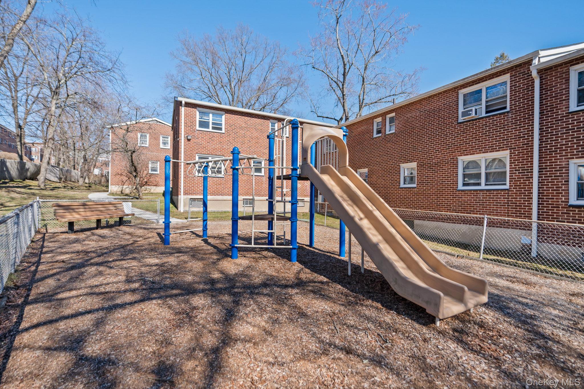 9 Geneva Road, Unit 9 Ossining, NY 10562 - Photo 26 of 26 a backyard of a house with barbeque oven and outdoor seating