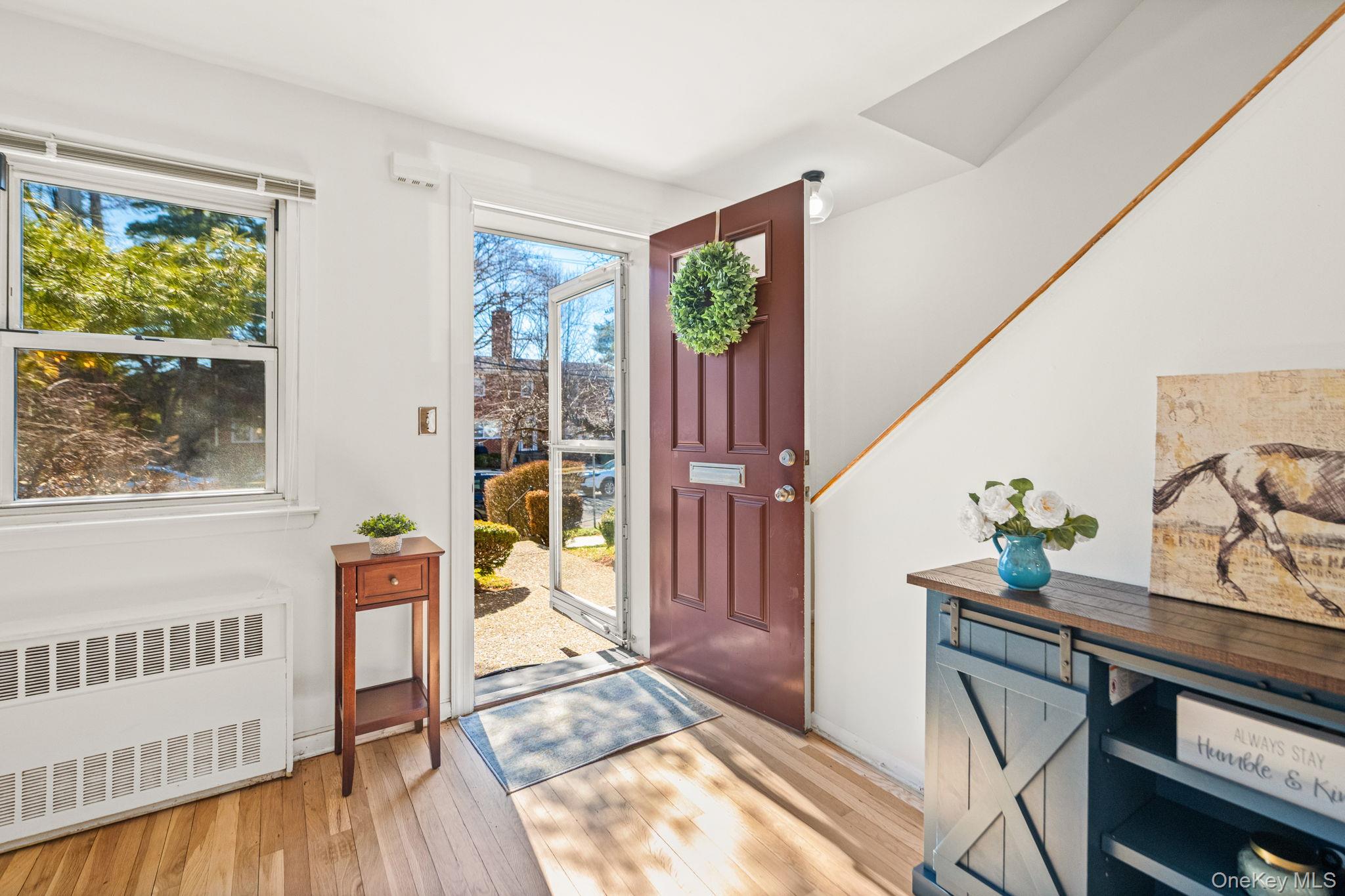 9 Geneva Road, Unit 9 Ossining, NY 10562 - Photo 4 of 26 a living room with furniture and a window