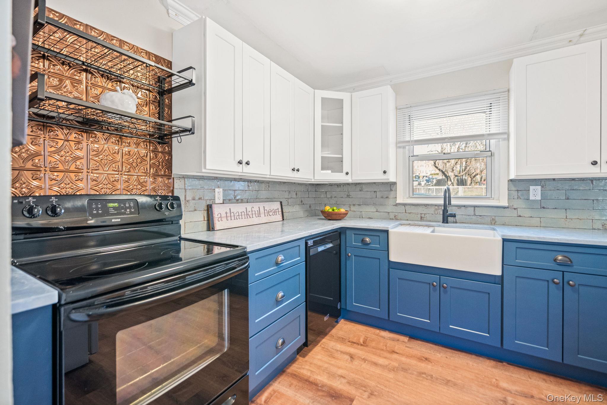 9 Geneva Road, Unit 9 Ossining, NY 10562 - Photo 5 of 26 a kitchen with a sink stove and cabinets