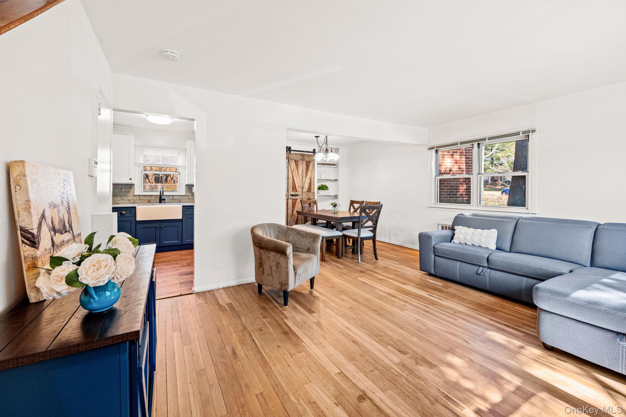 9 Geneva Road, Unit 9 Ossining, NY 10562 - Photo 8 of 26 a living room with furniture and wooden floor