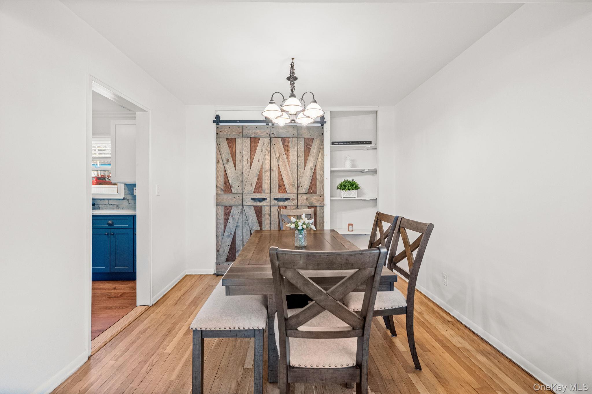9 Geneva Road, Unit 9 Ossining, NY 10562 - Photo 10 of 26 a view of a dining room with furniture and wooden floor