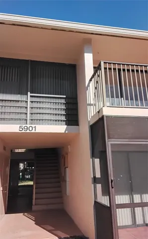 a view of a backyard with sitting area