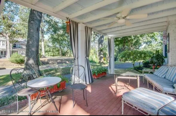 a outdoor living space with furniture and a garden