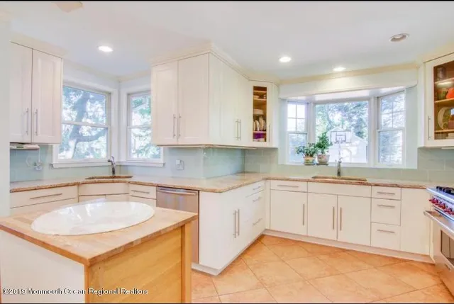 a kitchen with sink cabinets and window