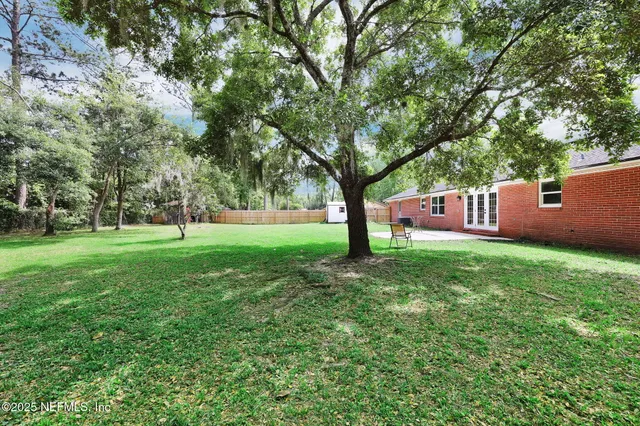 a view of a house with a big yard