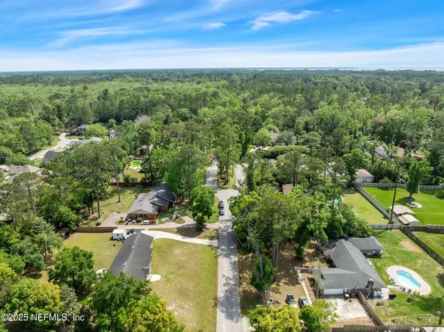 an aerial view of residential house with outdoor space