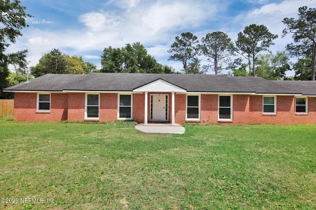 front view of a house and a yard