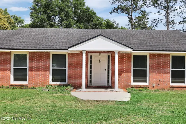 front view of a house with a yard