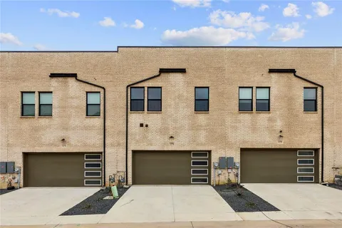 a front view of a house with parking