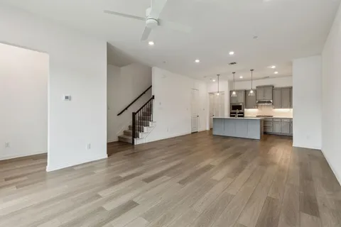 a view of a kitchen with a sink and a stove top oven