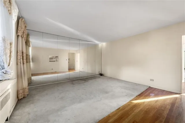 an empty room with a bench