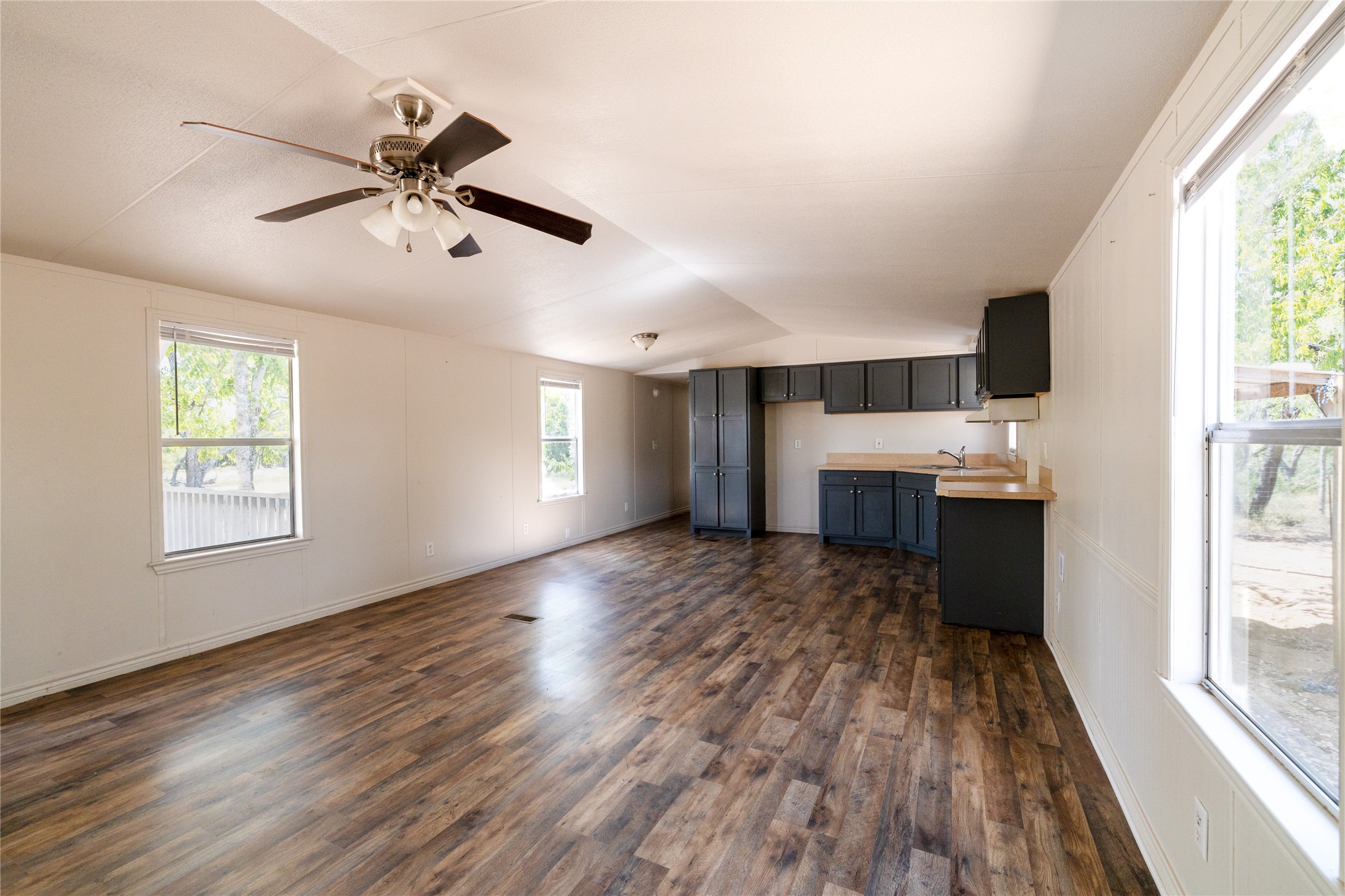 1265 Bugtussle Lane Lockhart, TX 78644 - Photo 4 of 16 a view of living room with wooden floor and window