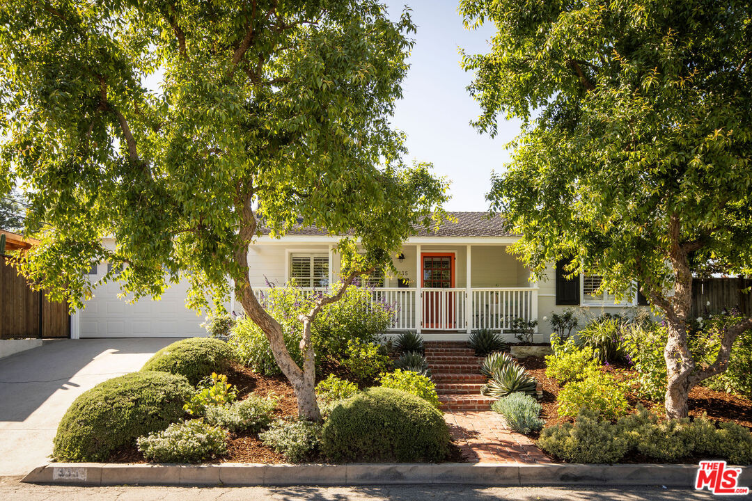 a view of a house with a garden