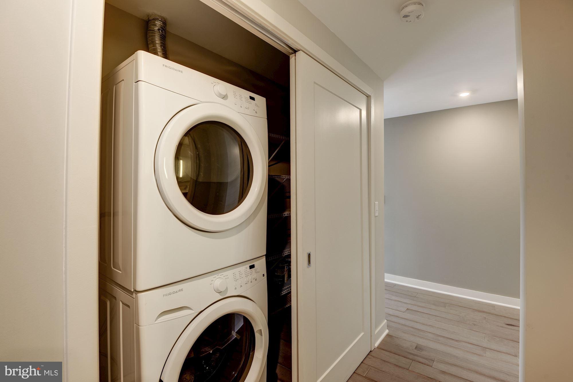 1320 Fenwick Lane, Unit 202 Silver Spring, MD 20910 - Photo 13 of 19 a close view of a utility room with dryer and washer