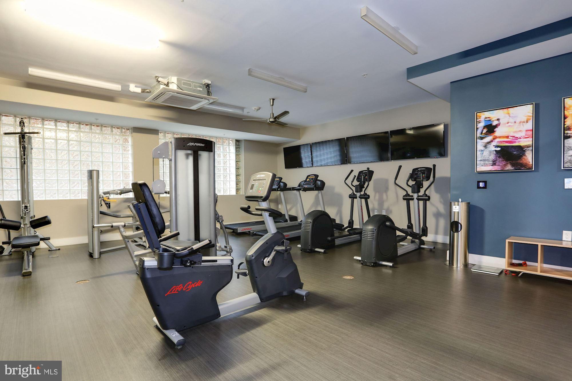1320 Fenwick Lane, Unit 202 Silver Spring, MD 20910 - Photo 14 of 19 a view of a room with gym equipment