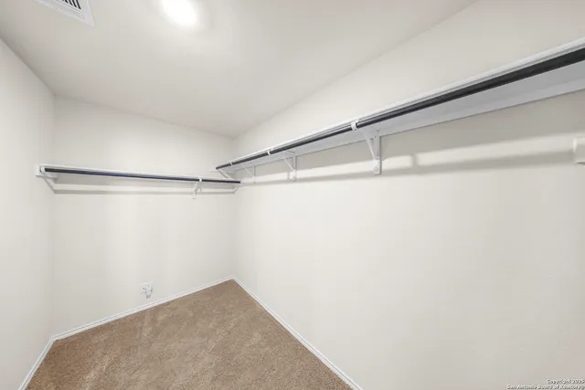 a view of a room with racks on the wall