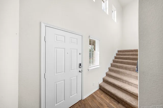 a view of staircase with white walls