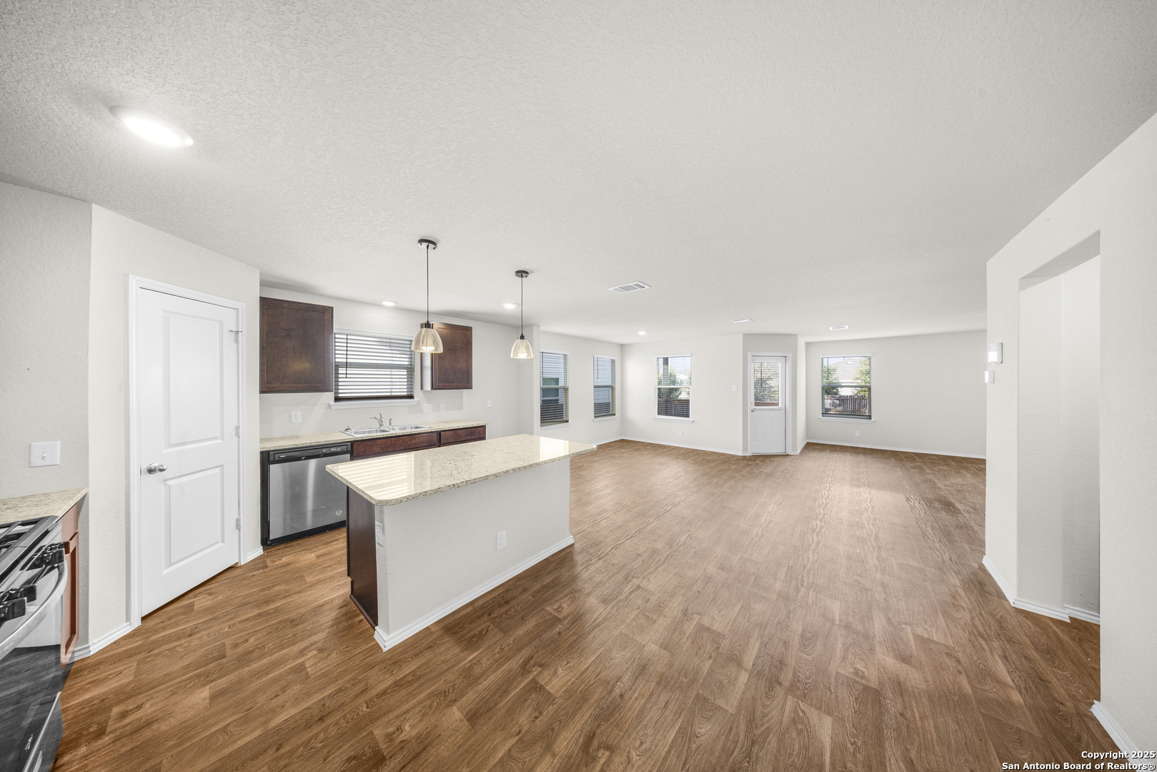 1023 Andean Emerald San Antonio, TX 78253 - Photo 3 of 19 a living room with hard wood floors and a kitchen