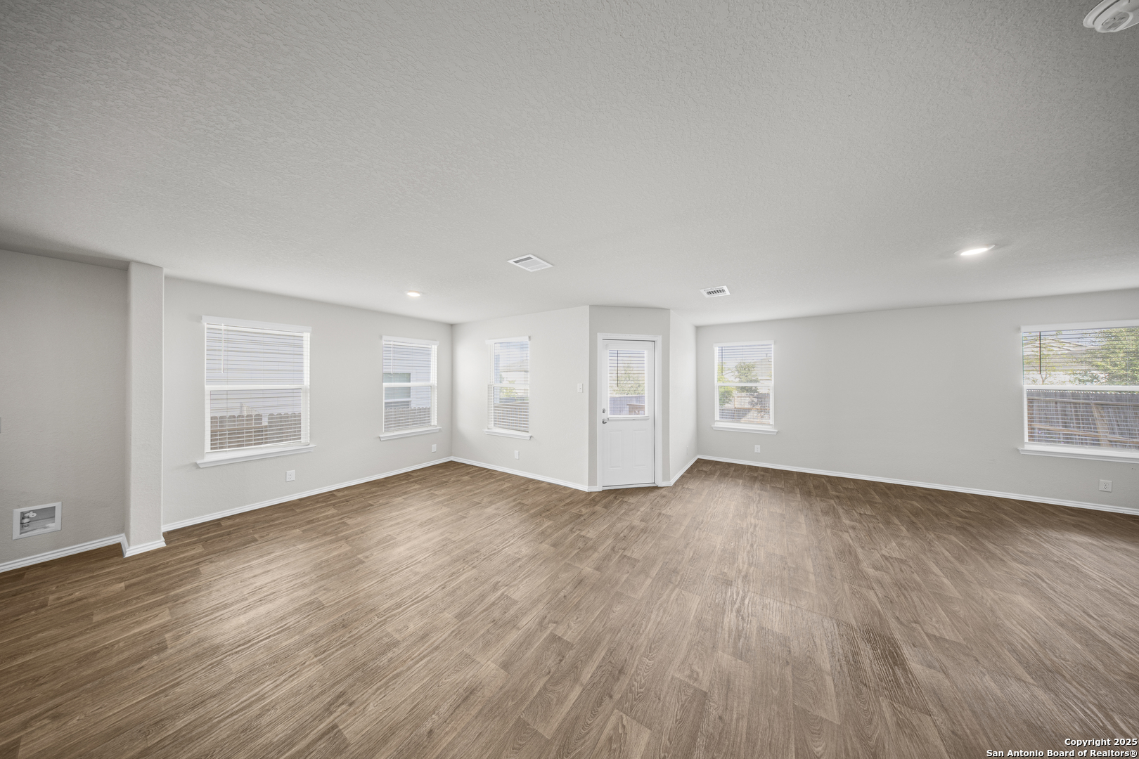 1023 Andean Emerald San Antonio, TX 78253 - Photo 7 of 19 an empty room with wooden floor and windows