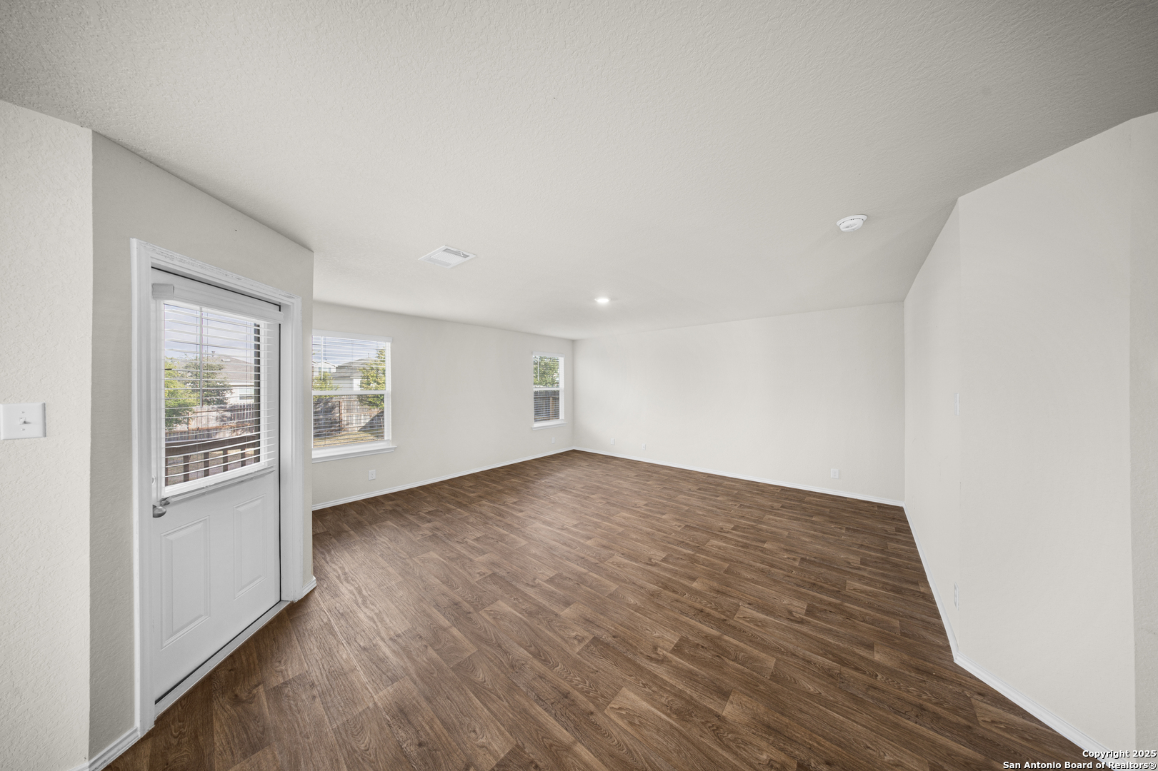 1023 Andean Emerald San Antonio, TX 78253 - Photo 8 of 19 wooden floor in an empty room with a window