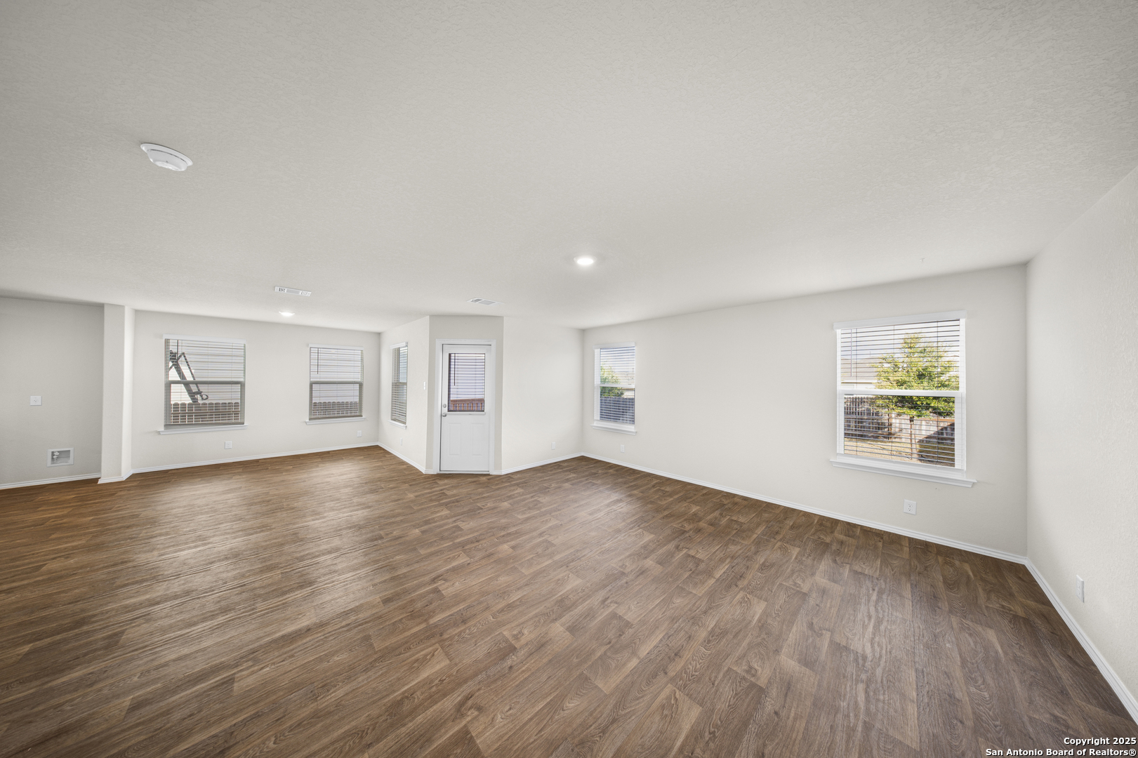 1023 Andean Emerald San Antonio, TX 78253 - Photo 9 of 19 a view of empty room with wooden floor and window