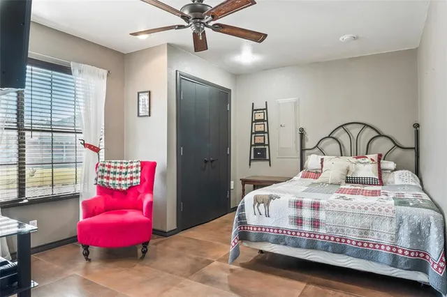 a bedroom with a bed and window