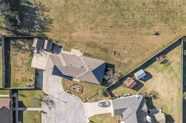 an aerial view of residential houses with outdoor space