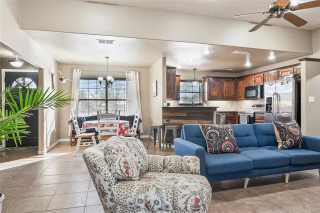 a living room with furniture and a large window
